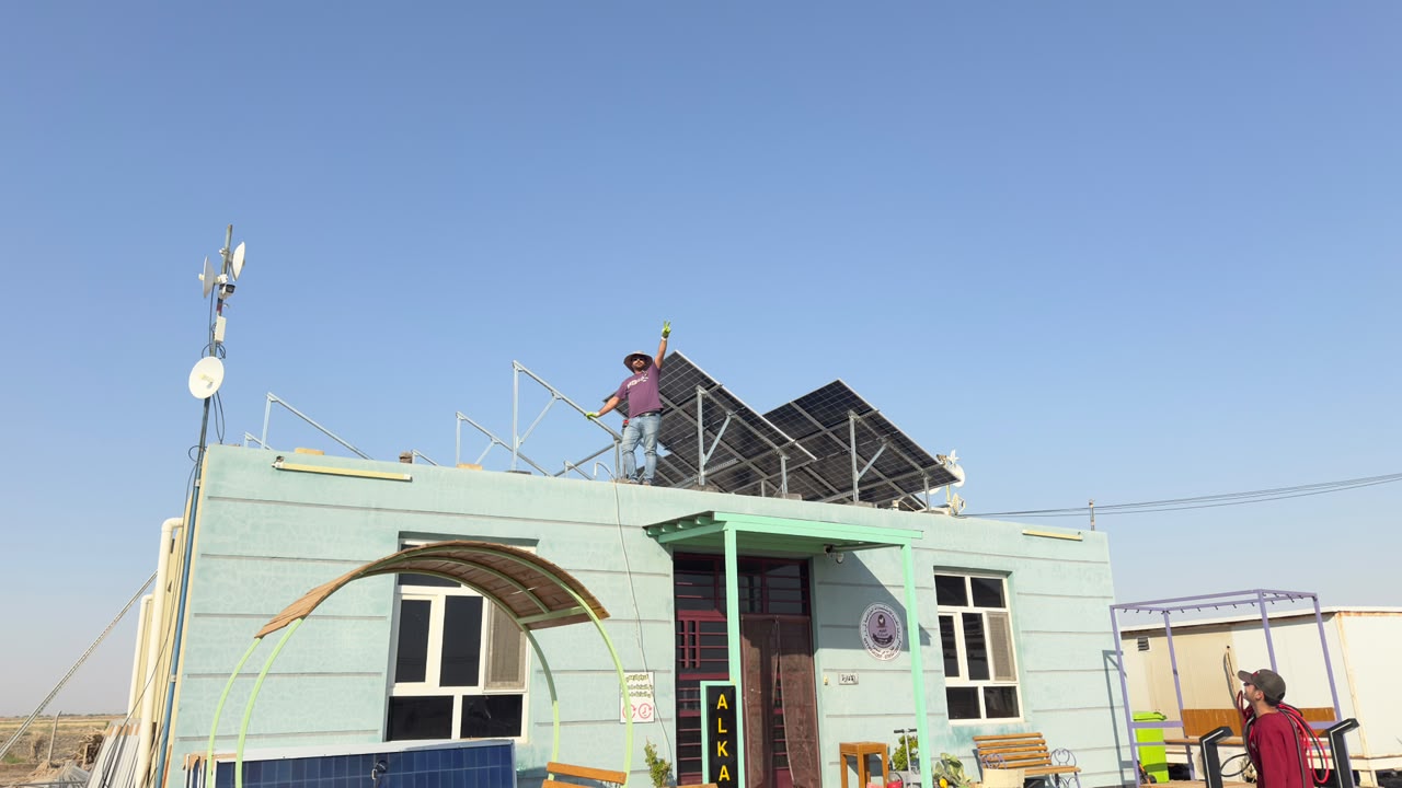 IQSTS technician working on a rooftop solar installation