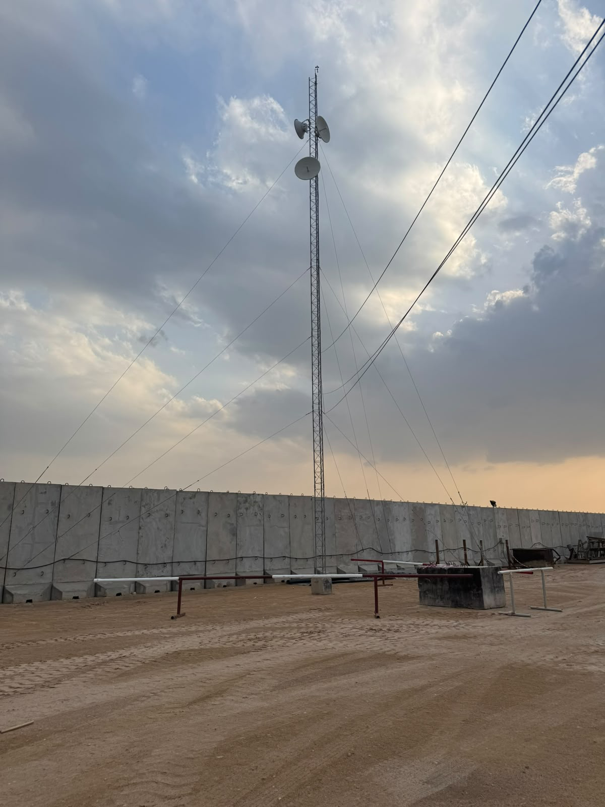 Microwave communications tower serving an industrial site
