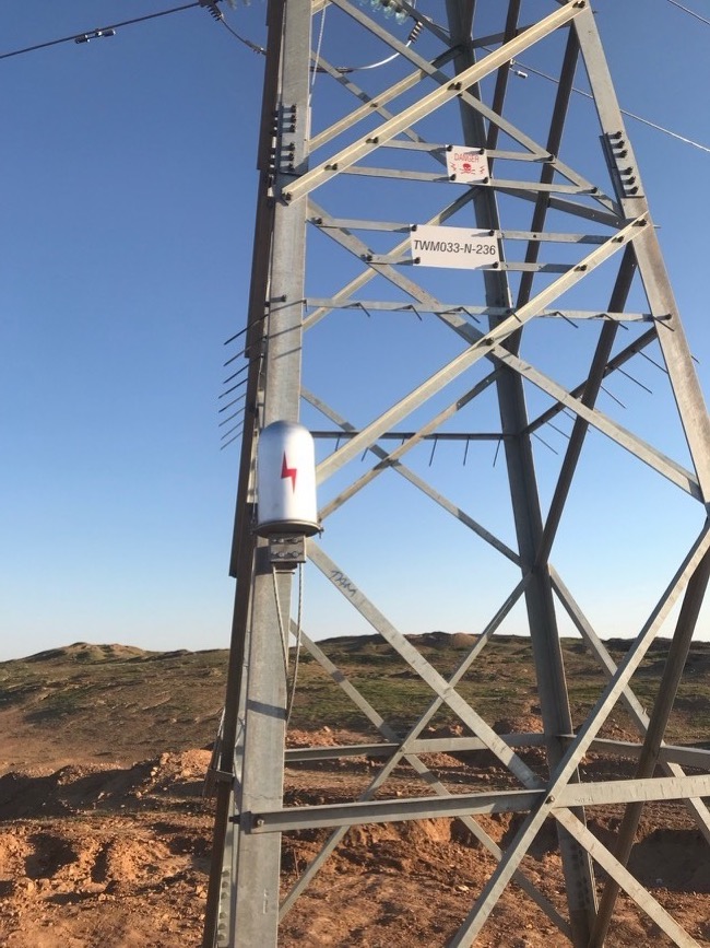 OPGW fiber installation on an overhead power line tower